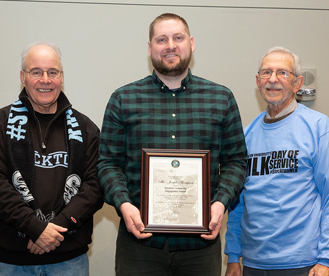 Joseph Thompson pictured center with President Harvey Kesselman and Assistant Provost Thomas Grites