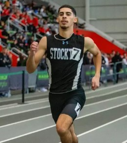 student running on track