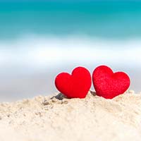 two hearts on sand