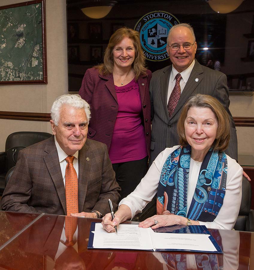Paxson and Michelle Keates, seated, with Stockton President Harvey Kesselman and First Lady Lynne Kesselman, sign Endowed Scholarship Agreement.