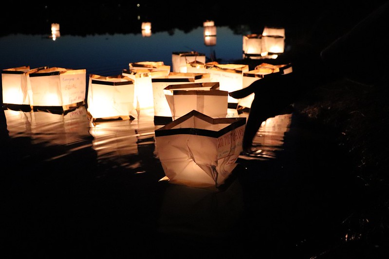 candle lit lanterns on lake fred