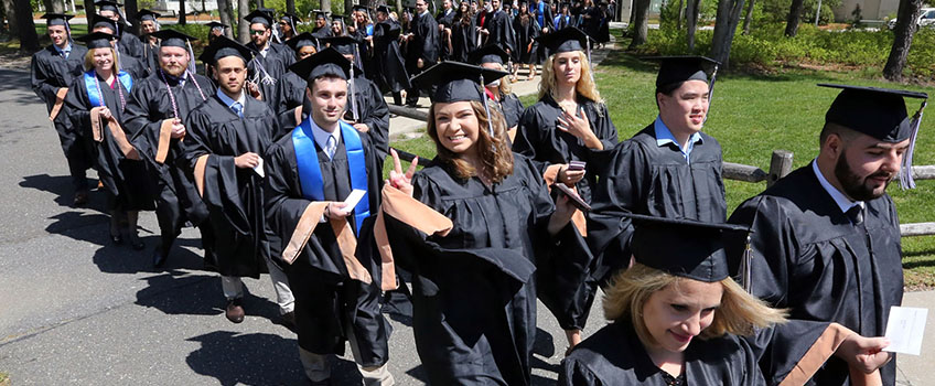 graduates processing outside