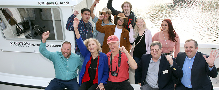 Seated from front left, Steve Everet, Judy Arndt, Alex Oppedyk, Peter Straub and Dan Nugent with students in the Marine Science program.