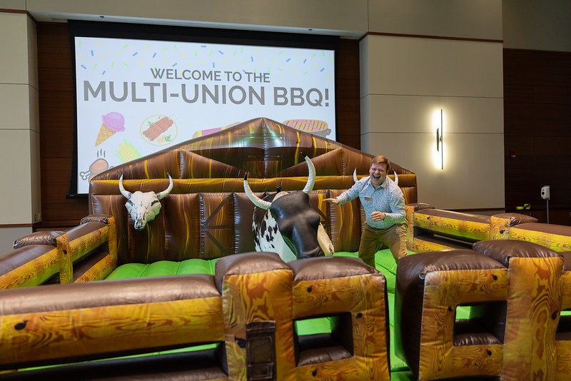 man next to mechanical bull