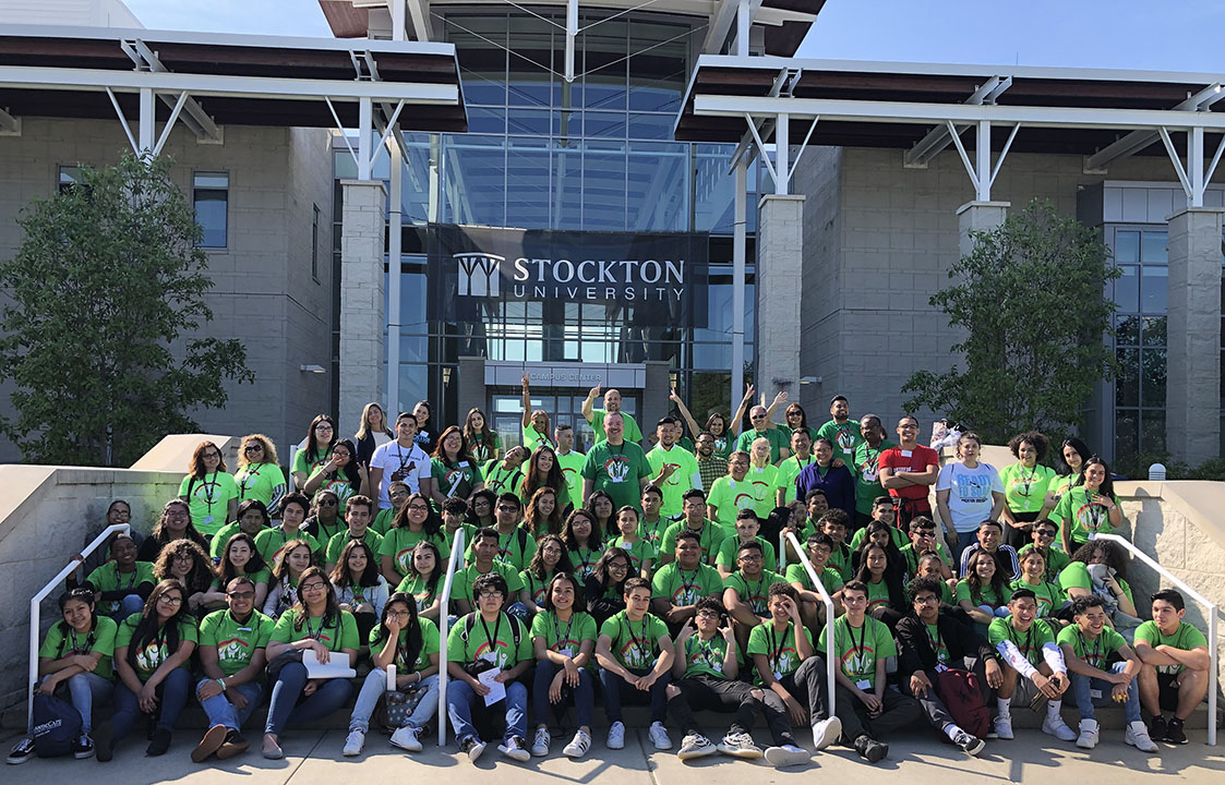 students and staff on steps 