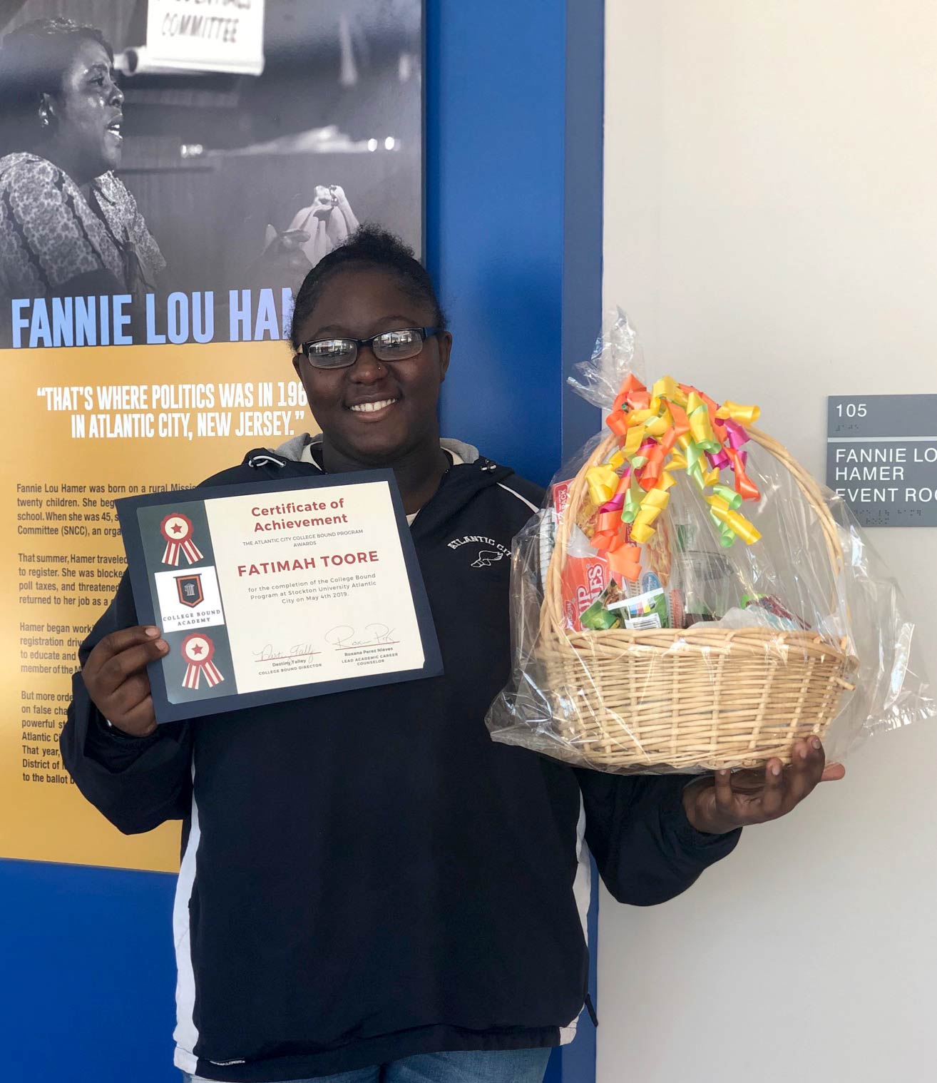 Fatimah Toore holds her Certificate of Achievement from the closing ceremony of the College Bound Program on May 4.