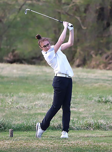 girl playing golf