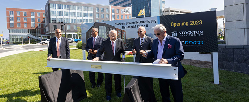 people signing beam 