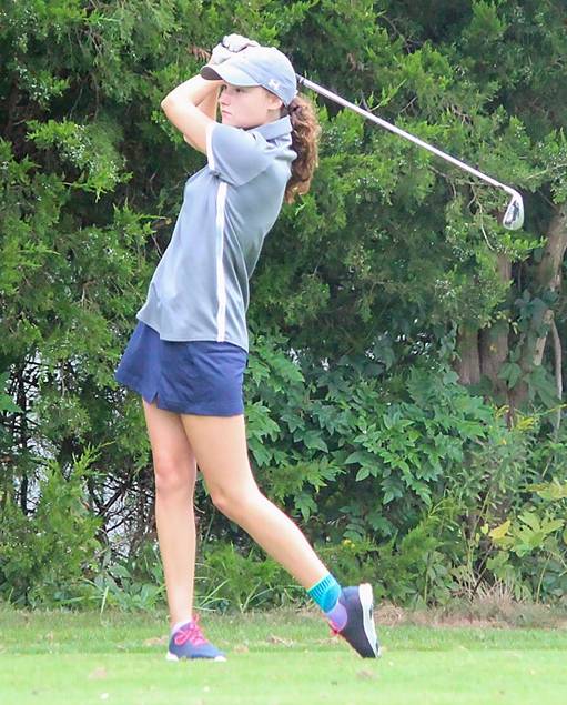 Girl playing golf