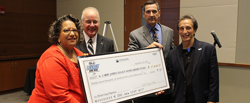 From left, Cynthia James with President Harvey Kesselman, Craig Stambaugh and Arnaldo Cordero-Roman