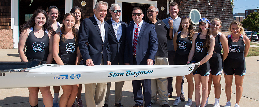 The Stockton Women’s Eight Rowing team with, from left, William Gormley, Stan Bergman, Kevin Duffy, John Bancheri and Sean Gormley.