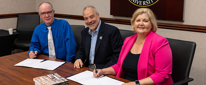 Tom Kinsella donation Tom Kinsella, left, makes donation