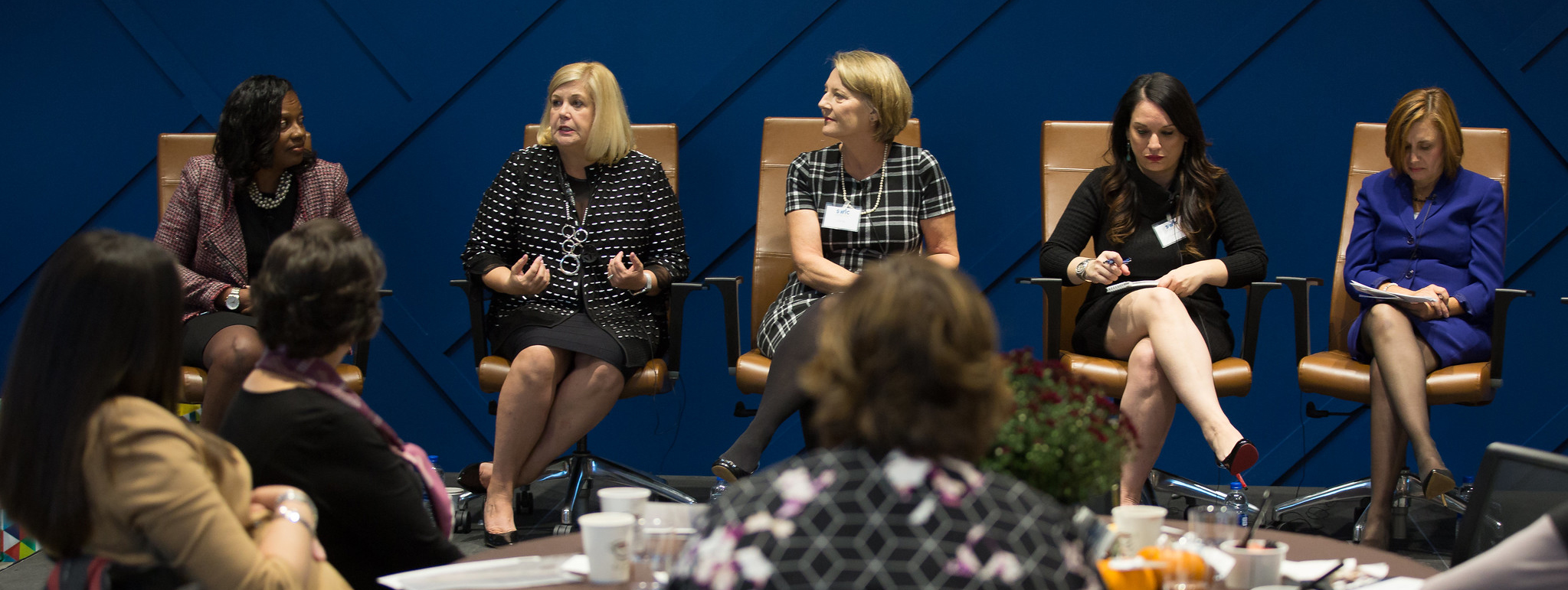 five women sitting on panel