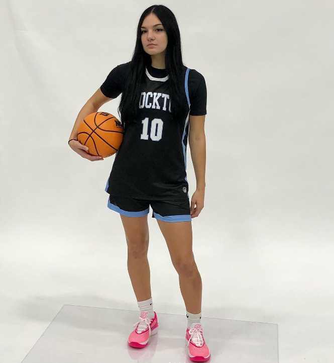 girl holding basketball