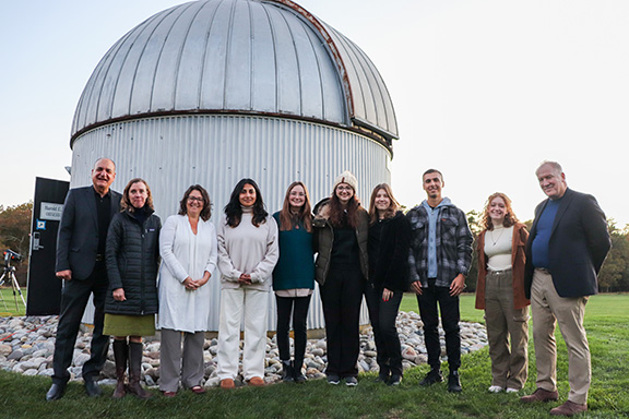 group of people at new telescope