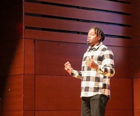 Man speaking on stage