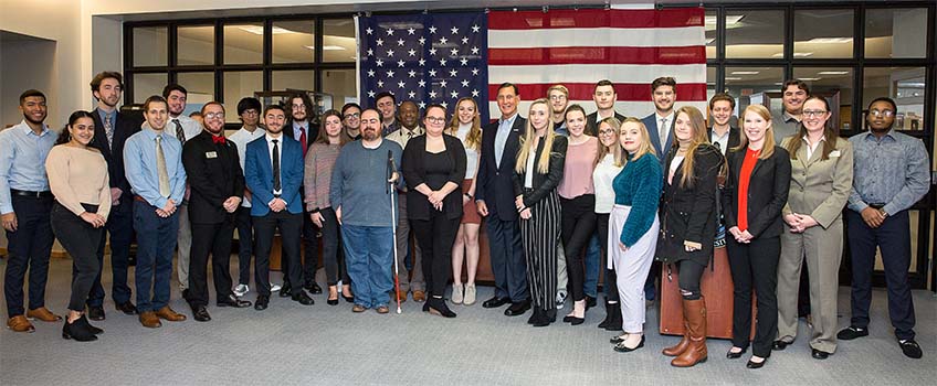 Retired U.S. Rep Frank LoBiondo, center, with the class that created the exhibit.