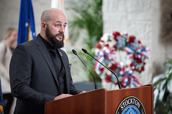 man speaking at podium