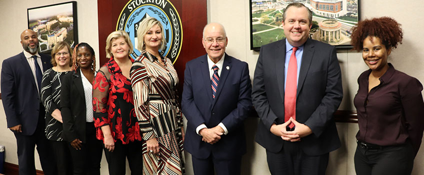 President Kesselman with group of people