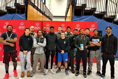 group of basketball players smiling