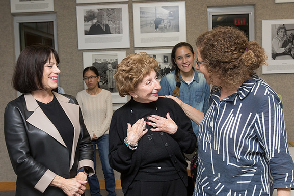 students and faculty talk to Bella Kurant