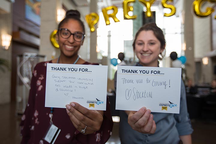 Students holding thank you notes