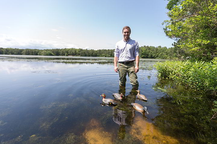 Cooper Rossner ‘18 takes his hand-carved decoys for a swim in Lake Fred.