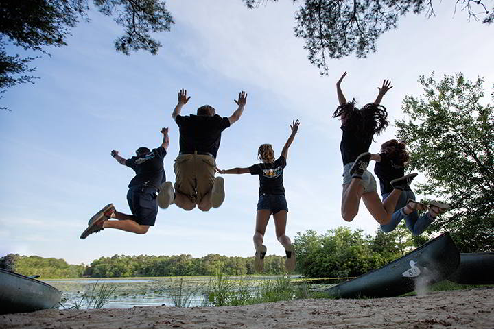 TALONS take a leap to celebrate their work in creating a bonding experience for transfer students.