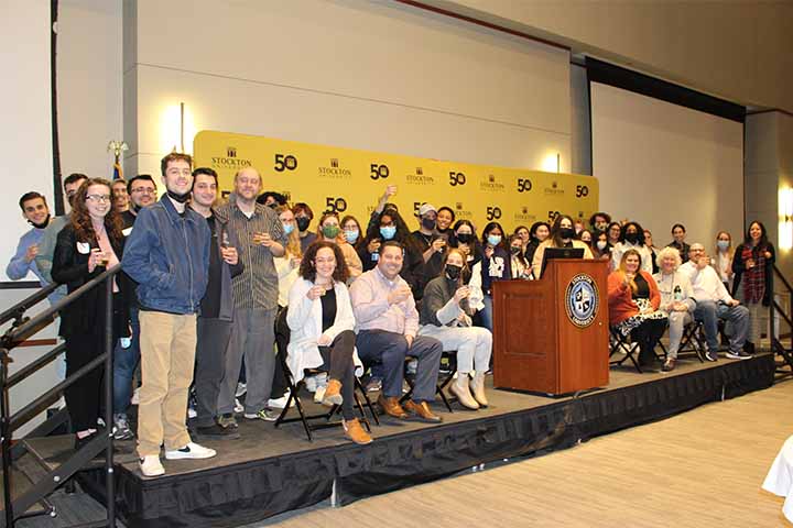 A group of reunited Campus Center workers