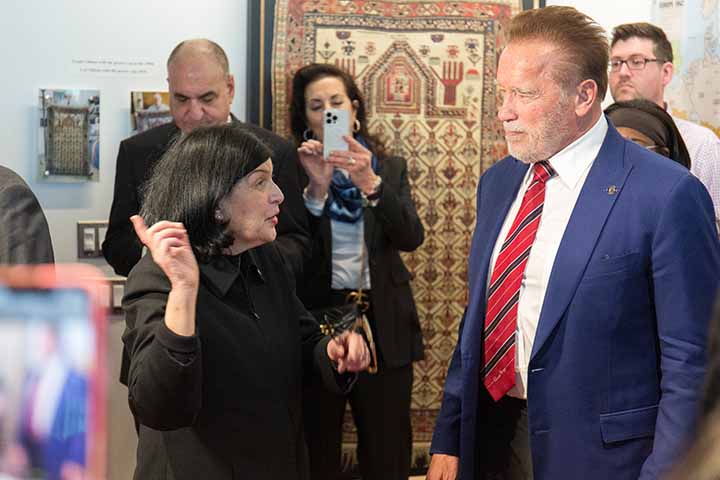 Gail Rosenthal and Arnold Schwarzenegger in the Holocaust Resource Center