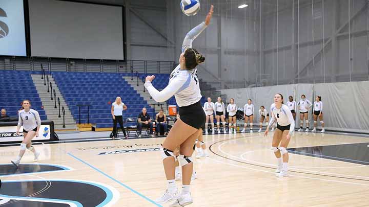 Women's volleyball team playing in the Sports Center