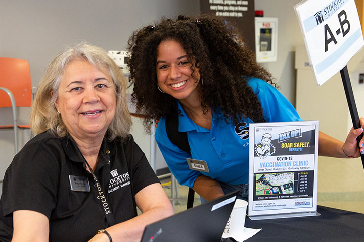 staff and student volunteering at an orientation event