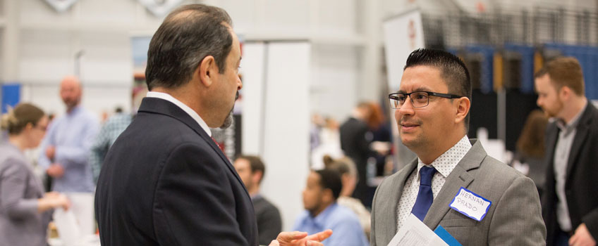 student and emploer at career event