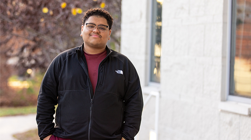 Carlos Barralaga in front of the Campus Center.