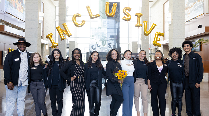 The CEO interns surrounding Ana Edmondson, interim assistant vice president for Student Transition Access and Retention, during the inaugural Inclusive Leadership Conference on April 14.