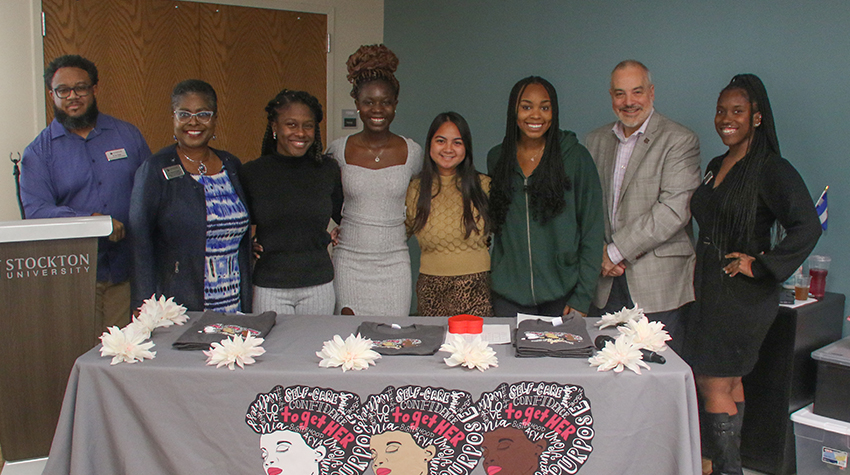 Vera and other executive board members of TogetHER with co-advisor Ian Bouie, EVP Terricita Sass, President Joe Bertolino and co-advisor Desiree Robinson.