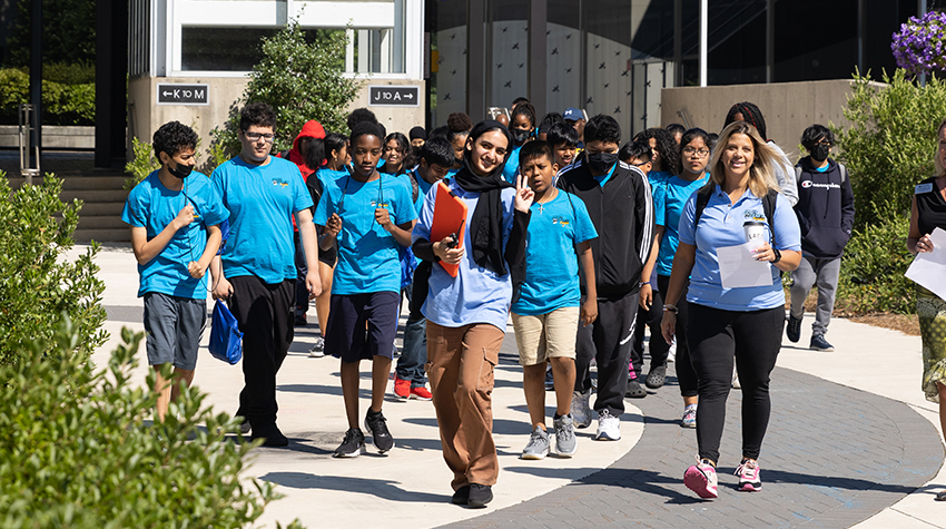 Zikra leading students from one session to another during the GOALS/GEAR UP program in 2022.