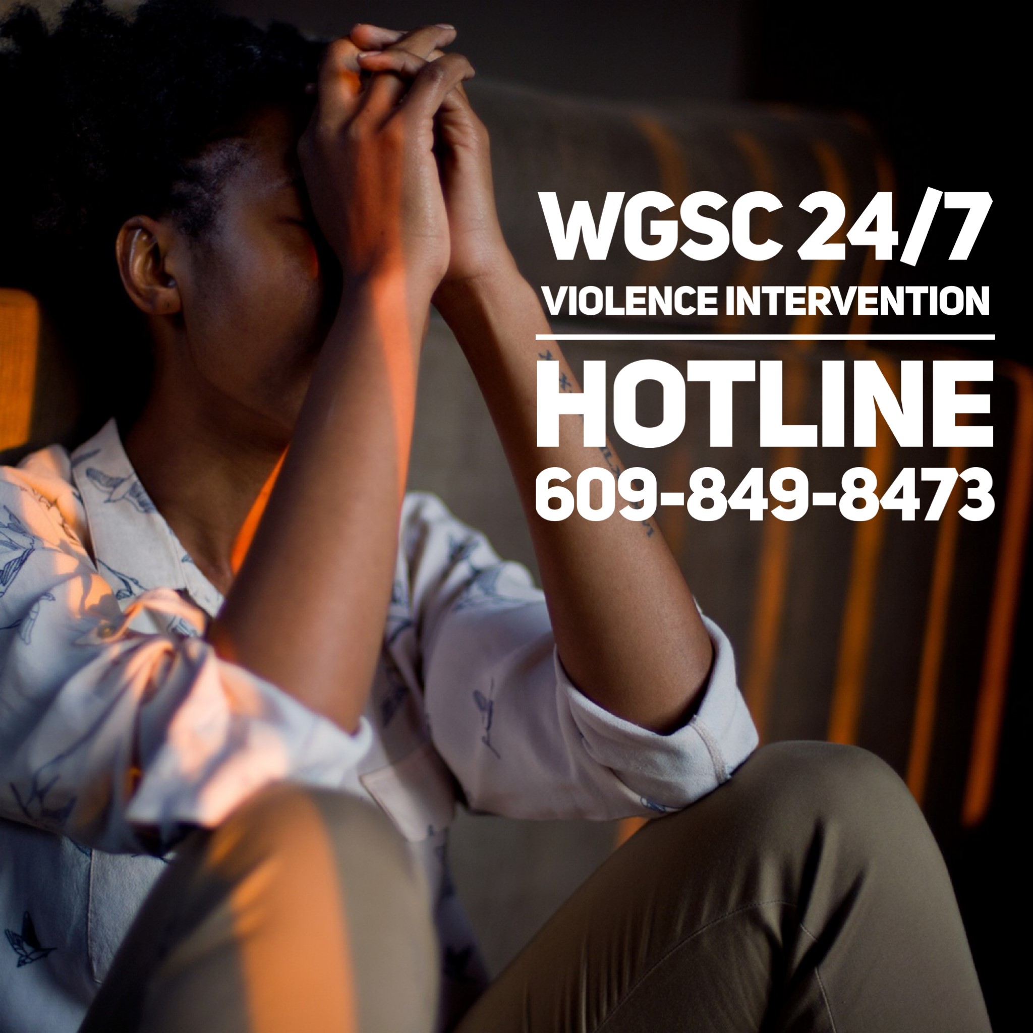 Girl with head in hands.  Hotline number listed 609-849-8473.